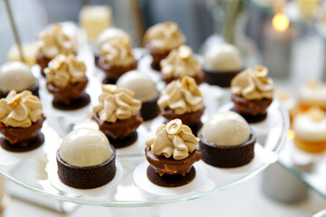 Delicious desserts, Sweet cakes, delicious eclairs, Table candies, mini cakes, Delicious wedding, holiday. Birthday, banquet table,