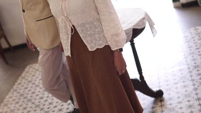 person in a suit in javanese traditional outfit for prewedding or wedding