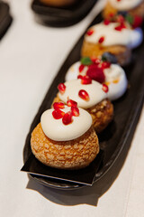 Delicious desserts, Sweet cakes, delicious eclairs, Table candies, mini cakes, Delicious wedding, holiday. Birthday, banquet table,