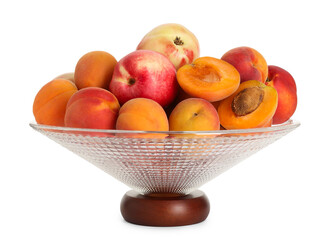 Glass vase with different fresh fruits isolated on white