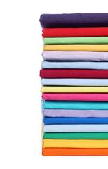 Stack of clean colorful t-shirts isolated on white