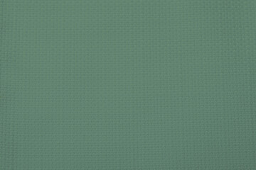 Sage color fabric as background, top view