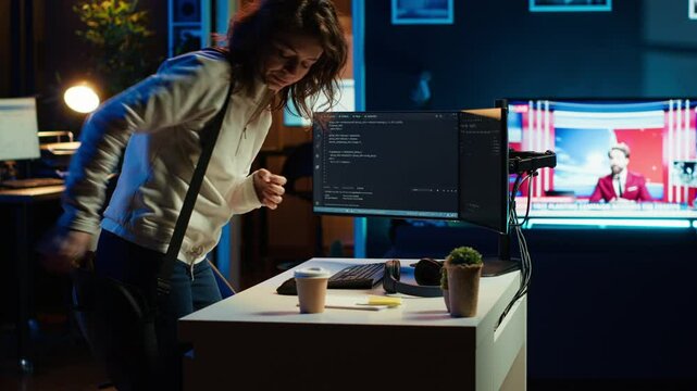 Developer holding disposable cup of coffee entering office to implement security measures, protecting company systems and data. IT worker starting job shift, testing and debugging code, camera A
