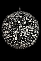 Obraz premium A sphere made up of various musical symbols and notes on a black background.