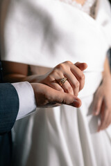 bride and groom holding hands