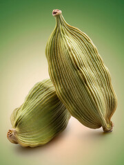 cardamom spice on green background