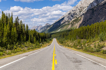 Scenic Highway Drive Through Majestic Mountains in Kananaskis, Alberta, Canada on a Clear Sunny Day