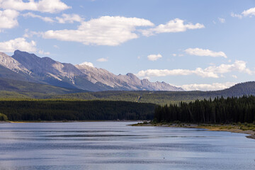 Scenic View of the Rocky Mountains Across the Water in Kananaskis, Alberta, Canada on a Clear Day