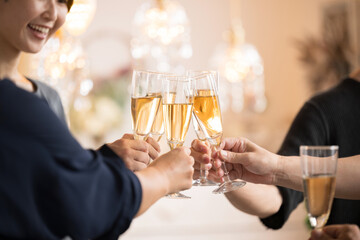 Image of toasting with champagne and wine glasses Close-up of hands without face