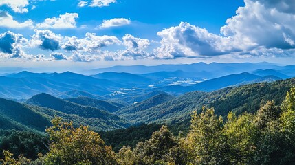 Fototapeta premium A breathtaking view of rolling mountains, lush forests, and a clear blue sky.