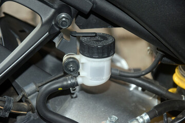 hydraulic fluid reservoir in the rear brake system of a motorcycle