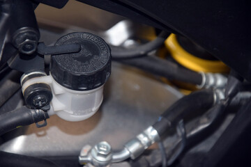 hydraulic fluid reservoir in the rear brake system of a motorcycle