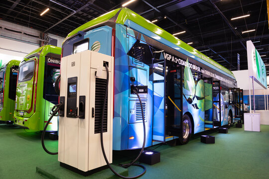 Electric bus vehicle with electric charging interface.