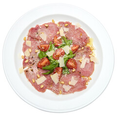 cooking tuna carpaccio - cherry tomato pieces on a plate with raw tuna fillet slices