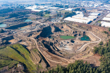 Aerial drone view of a mining site with heavy machinery near Salem, Oregon