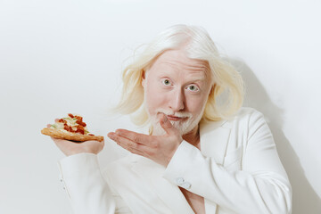 Funny man with long white hair holding a slice of pizza in a white suit, showcasing a lighthearted...