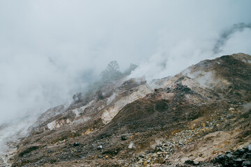gas vapor activity in the crater of an amazing active volcano