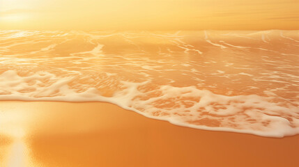 The golden orange sand beach sparkles and reflects the sunlight.