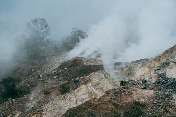 Breathtaking view of volcanic landscape, eruption fumarole, gas-steam activity in crater of active...