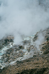 A breathtaking view of an active volcano emitting gas vapor in the crater