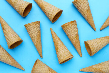 Waffle cones on blue background