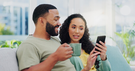 Happy couple, relax and browsing with phone on sofa for social media, online shopping or connectivity at home. Young, man and woman with coffee or mobile smartphone for internet connection at house