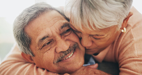 Hug, support and senior couple in house, love and care with retirement, happiness and bonding together. Apartment, embrace and mature woman with elderly man on sofa, relax and comfortable in lounge