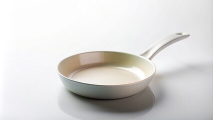 Ceramic frying pan with a minimalist design photographed in a studio against a white background, healthy cooking, culinary, minimalist design, utensil, studio shot, ceramic, cooking