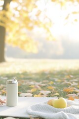 Autumn Yoga in the Park Woman Practicing Self-Care Amidst Fallen Leaves with Blanket, Thermos, and Fruits