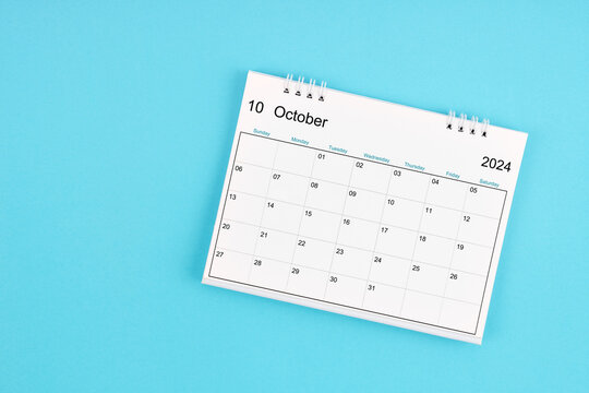 October 2024, Monthly desk calendar for 2024 year on blue background.