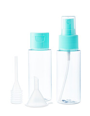 Clear plastic bottles with blue pumps and spray tops arranged on a white background