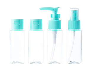 Clear plastic bottles with blue pumps and spray tops arranged on a white background