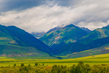 Embrace and enjoy a stunning and breathtaking view of majestic mountains and lush green valleys...
