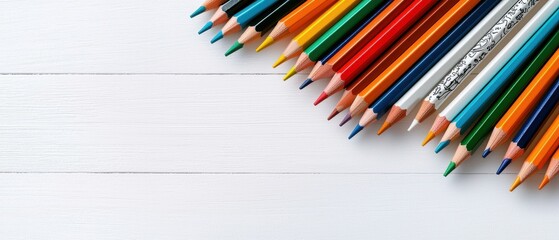 Obraz premium Colorful pencils arranged neatly on a wooden surface, perfect for art, creativity, and educational purposes.
