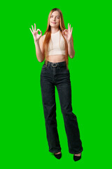 Young Woman With Long Hair Gesturing Okay Sign in Front of Green Screen