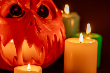 Halloween Pumpkin Staring with Colorful Candles