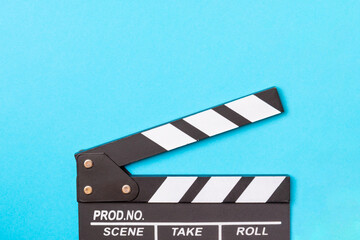 Movie clapper. Movie clapperboard on a bright colored background. Concept of rest and...