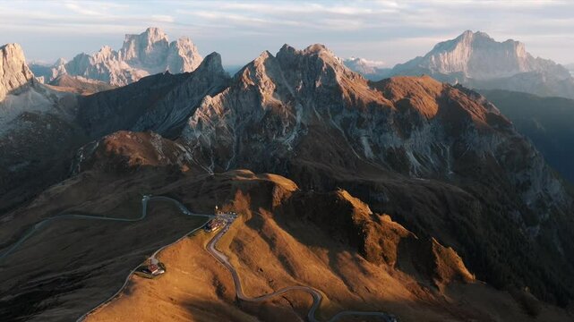 Aerial view of mountain peaks during sunrise in the Dolomites, Italy
