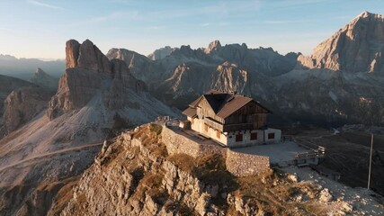 Aerial view of mountain peaks during sunrise in the Dolomites, Italy - Powered by Adobe