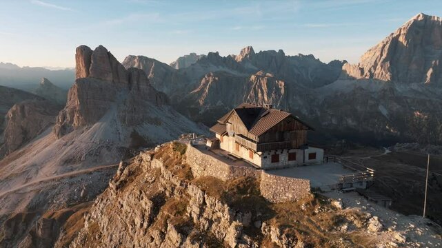 Aerial view of mountain peaks during sunrise in the Dolomites, Italy