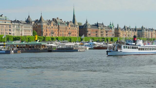 Stockholm City Strandv&auml;gen apartment buildings water and ships in summer time. Sunny day