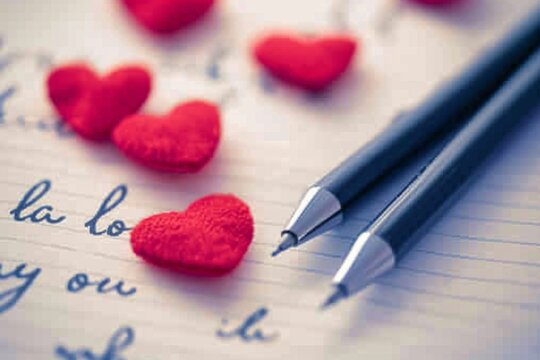 Heartfelt expressions on Valentines Day with love notes and decorative hearts for a romantic touch
