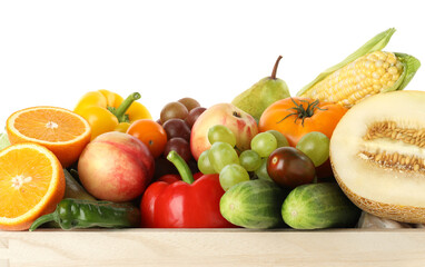 Different fresh fruits and vegetables in wooden crate isolated on white
