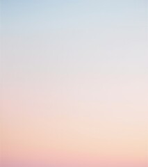 A soft gradient of pastel colors fades gently from pale blue at the top to a light pink at the bottom, creating a calm and serene atmosphere.