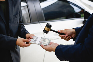 In a showroom, people engage in buying or leasing cars, working with salespeople to finalize contractsDiscussions involve choices agreements financingThe process includes paperwork explaining terms