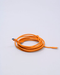 Silicone USB cable orange on white background