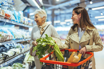 Smiling Women Shopping for Fresh Vegetables at the Supermarket