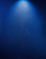 Dark blue wall gradient. HD quality. Gentle illumination falls from above, highlighting subtle...