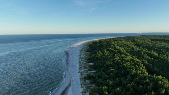 Hel city. Aerial view of Hel Peninsula in Poland, Baltic Sea and Puck Bay. Aerial video made by drone from above. End of poland hel peninsula. Hel beach in Poland. Sunset at sea and bay, Poland.