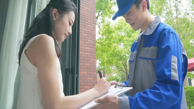 Delivery man Uniform smiles during express, courier holding a small package parcel Delivering goods to Customer's Home with Van Truck, door-to-door services.